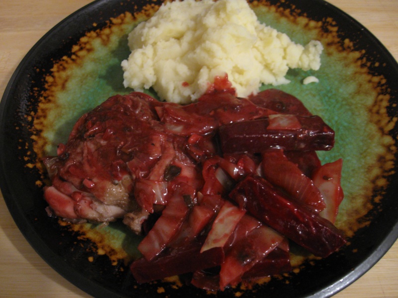 plated chicken with beets and cabbage